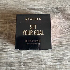 RealHer Blurring Veil Powder in Black Packaging